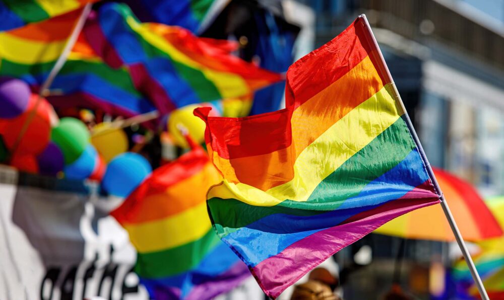 Lgbt pride rainbow flag during parade in the city