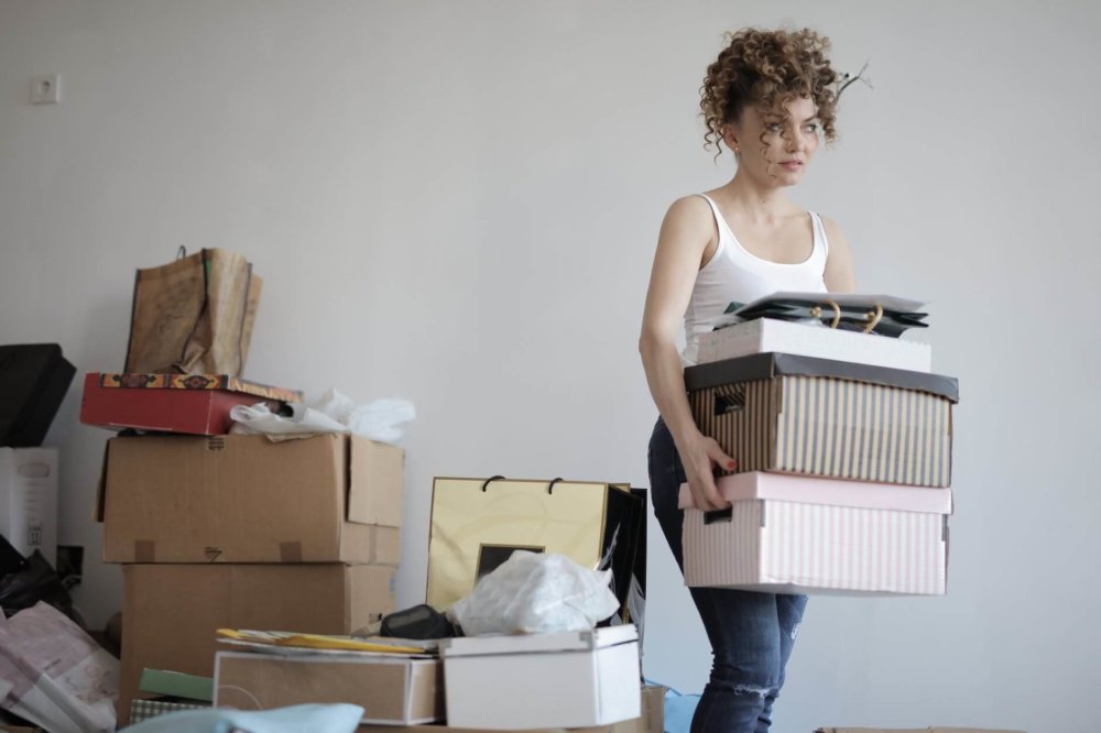 A woman carrying boxes