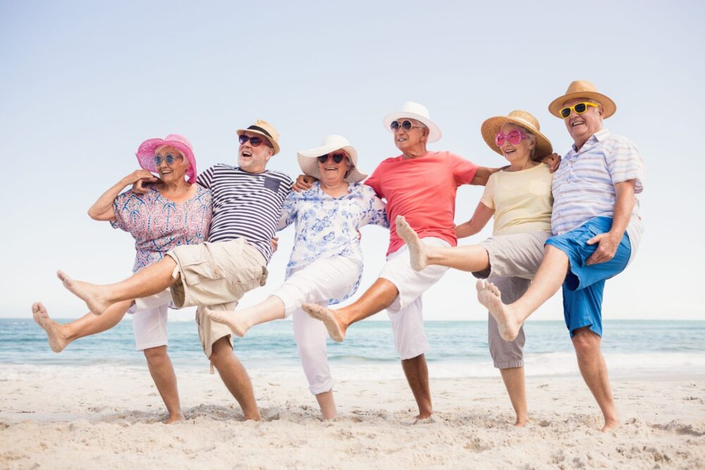 Group of elderly people having fun at the beach