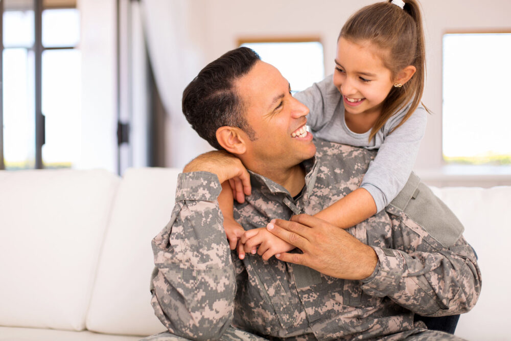 A soldier playing with his daughter