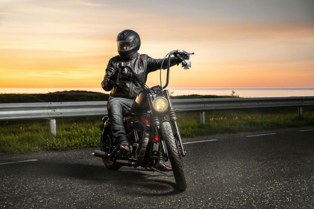 A man on a motorcycle, after a long-distance moving